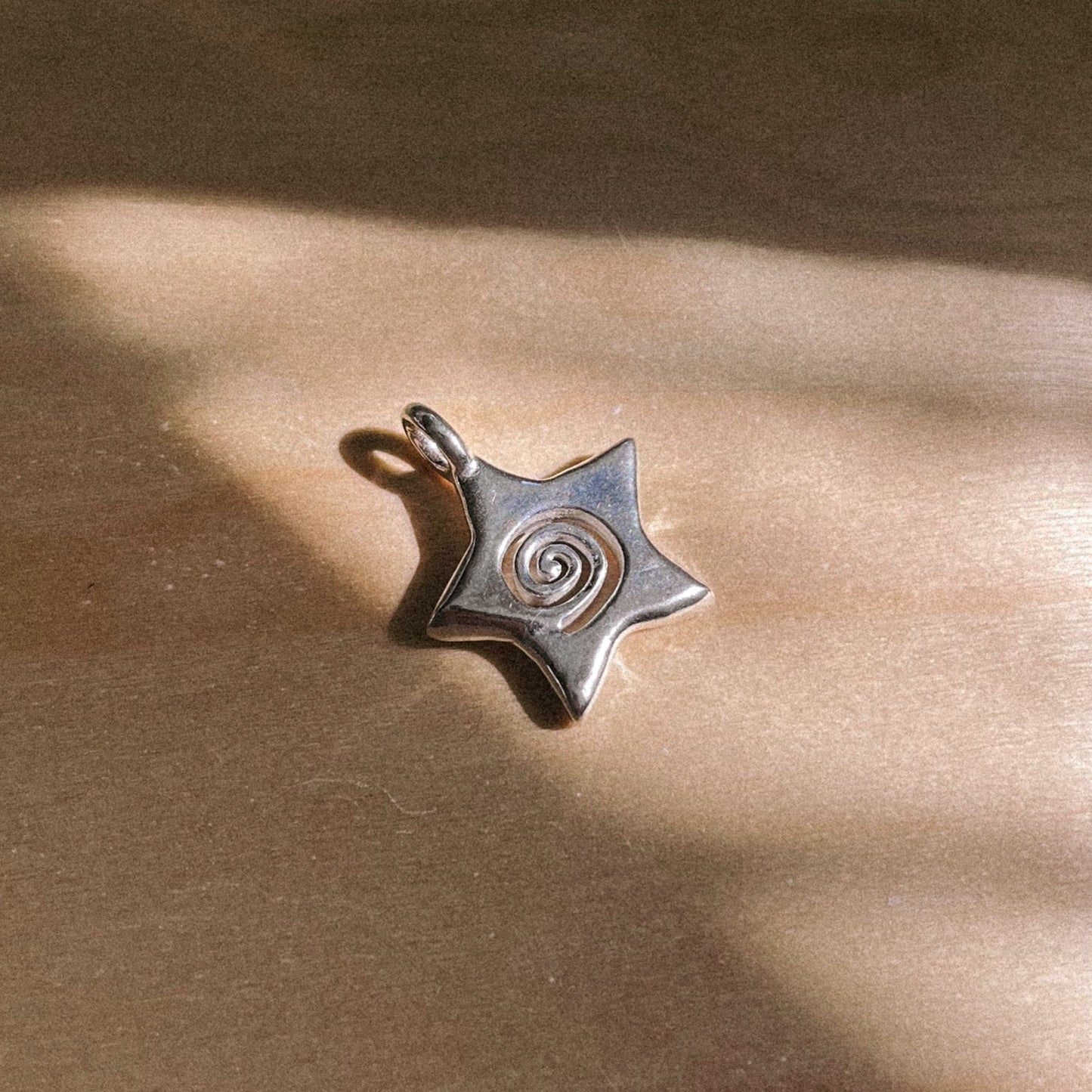 spiral star charm