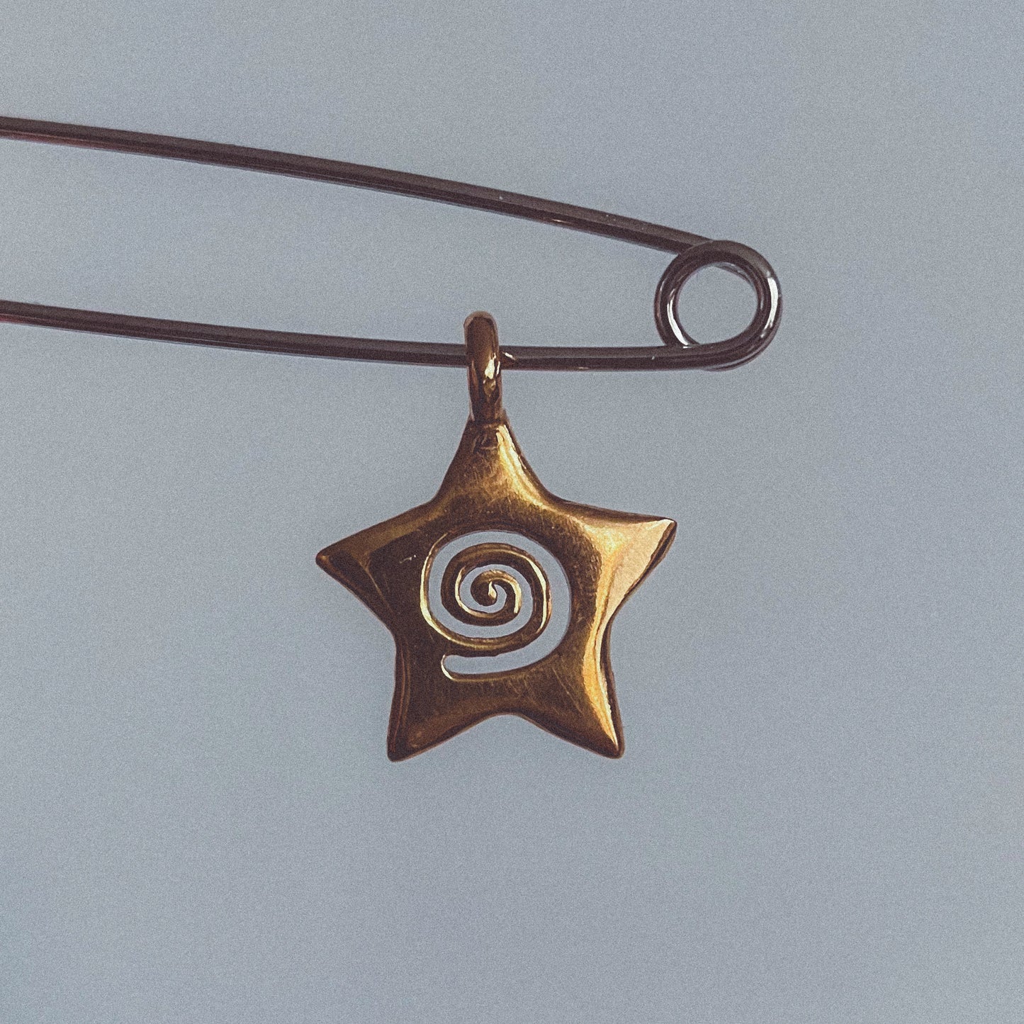 spiral star charm